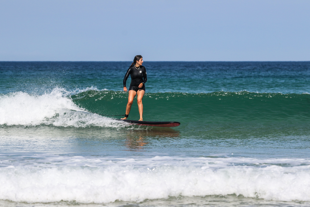 Woman Surfing at Fistral Beach
