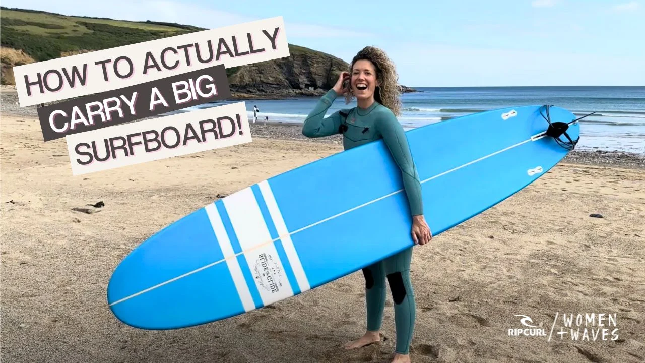Woman with big surfboard