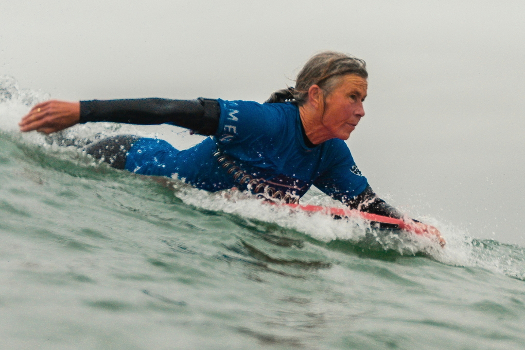Woman paddling a bodyboard