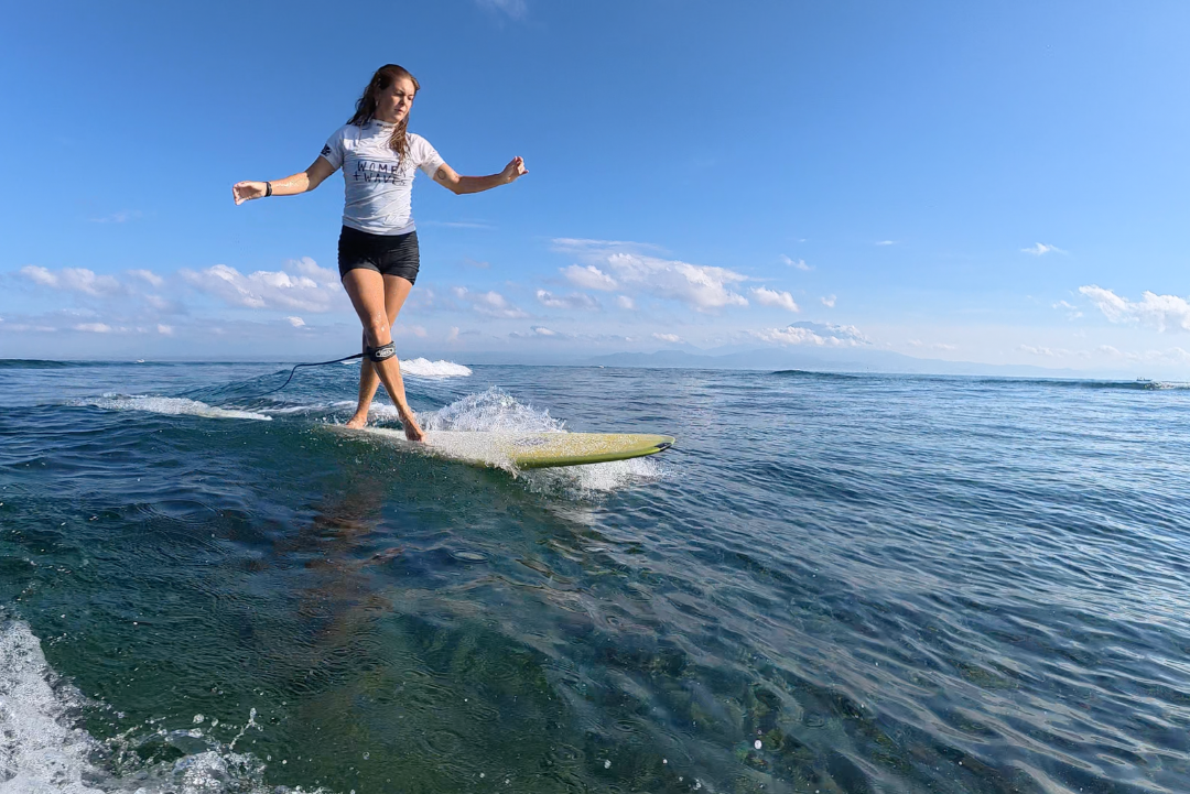 longboarding small waves in Bali
