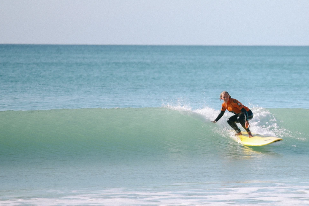Woman surfing in Portugal