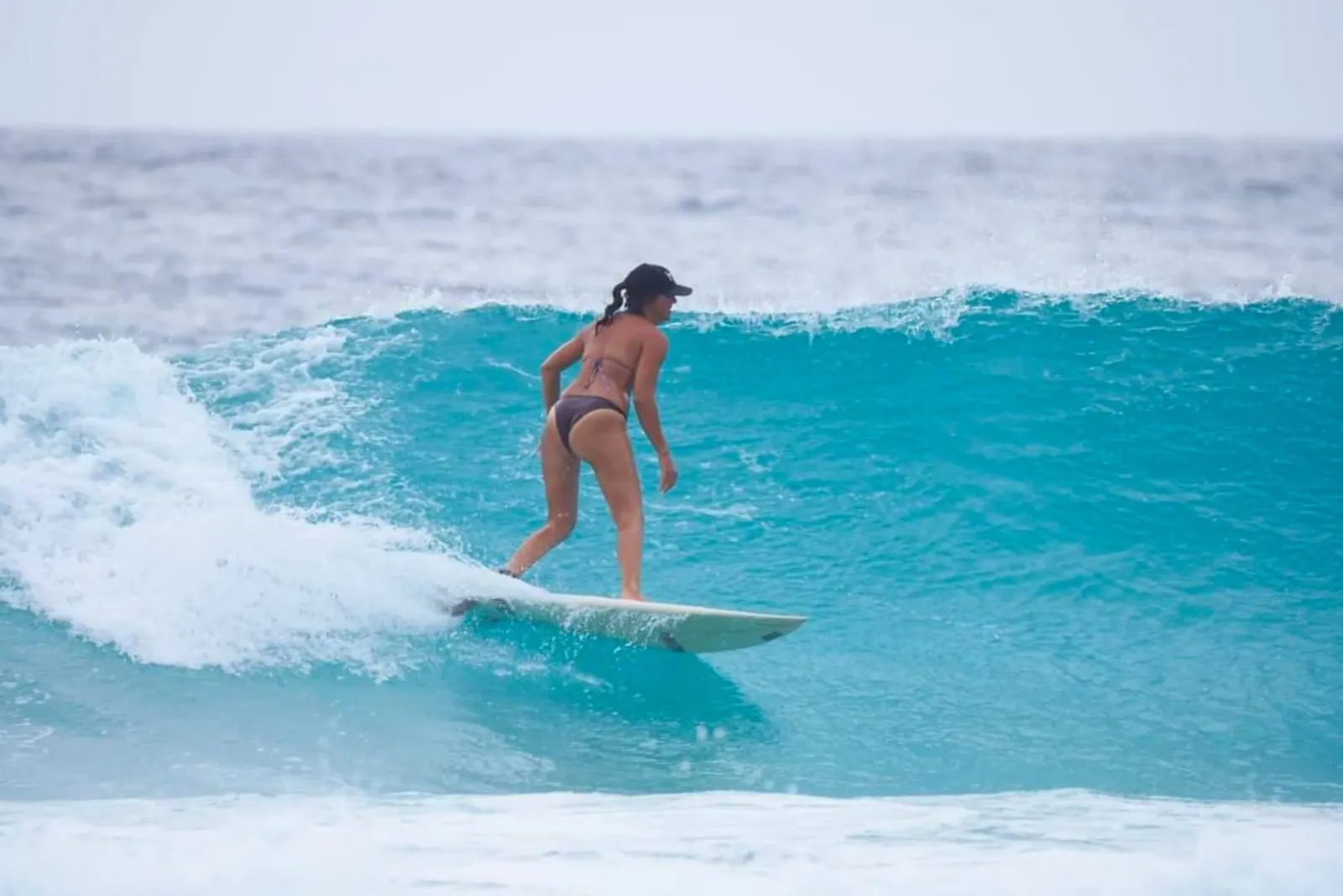 Barbados woman surfing