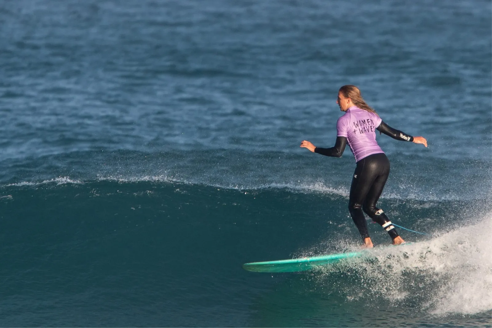 Surf girl on wave
