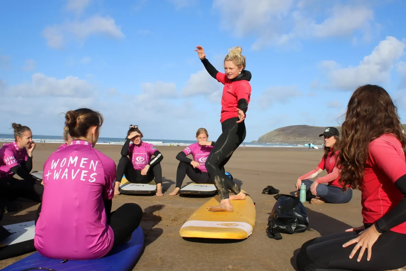 Surfers learning on the beach