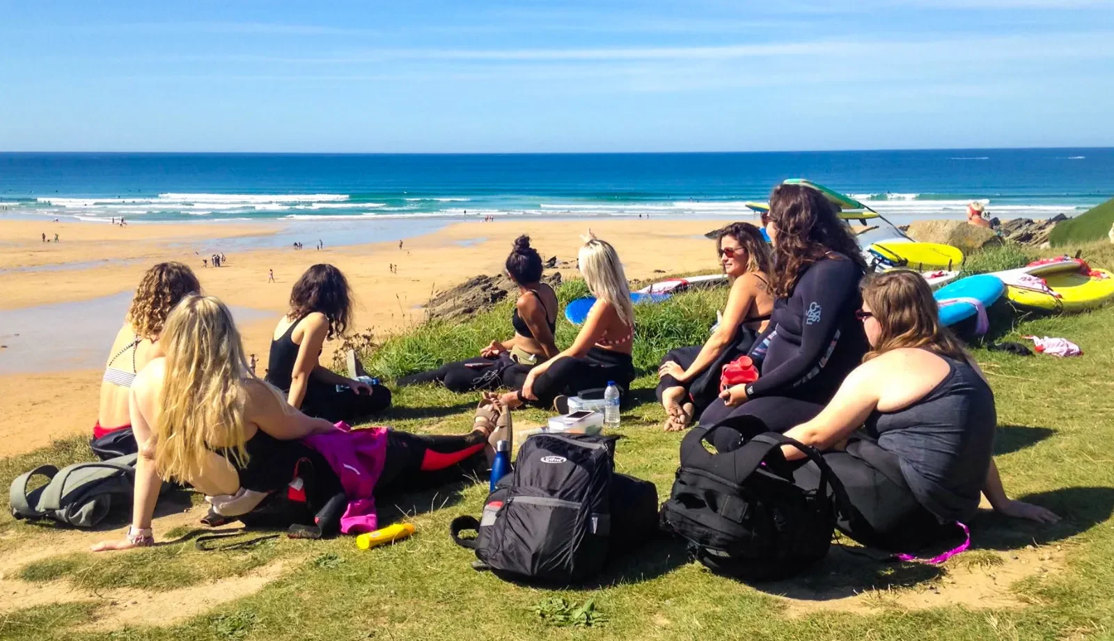 Surfers chilling by the beach