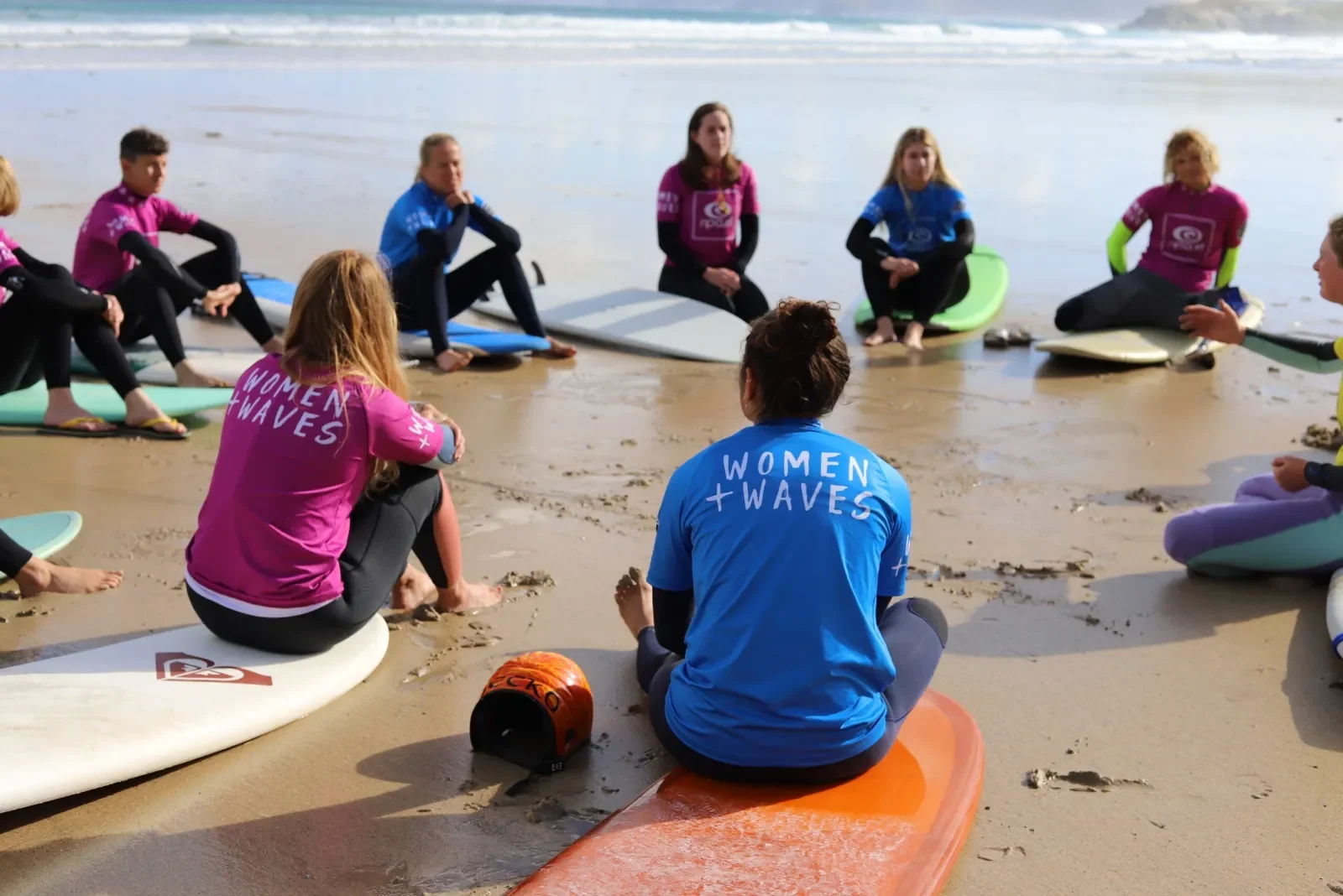 Surfers sat in group