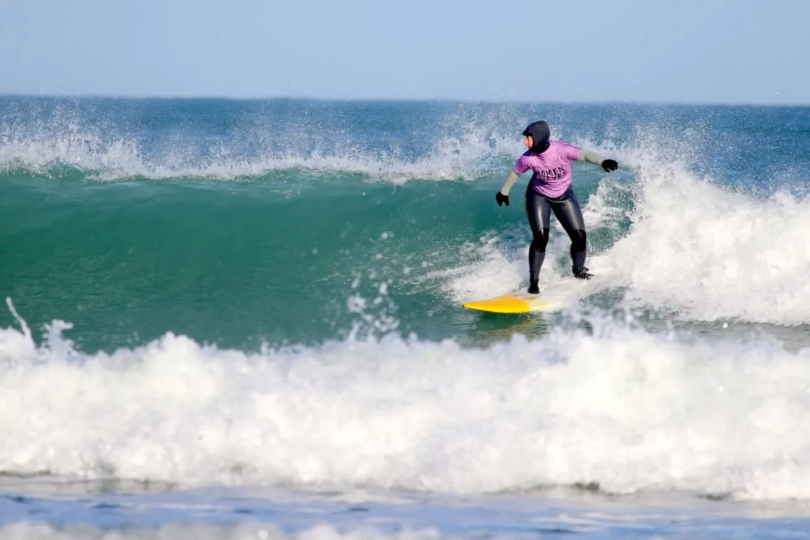 Woman surfer on wave