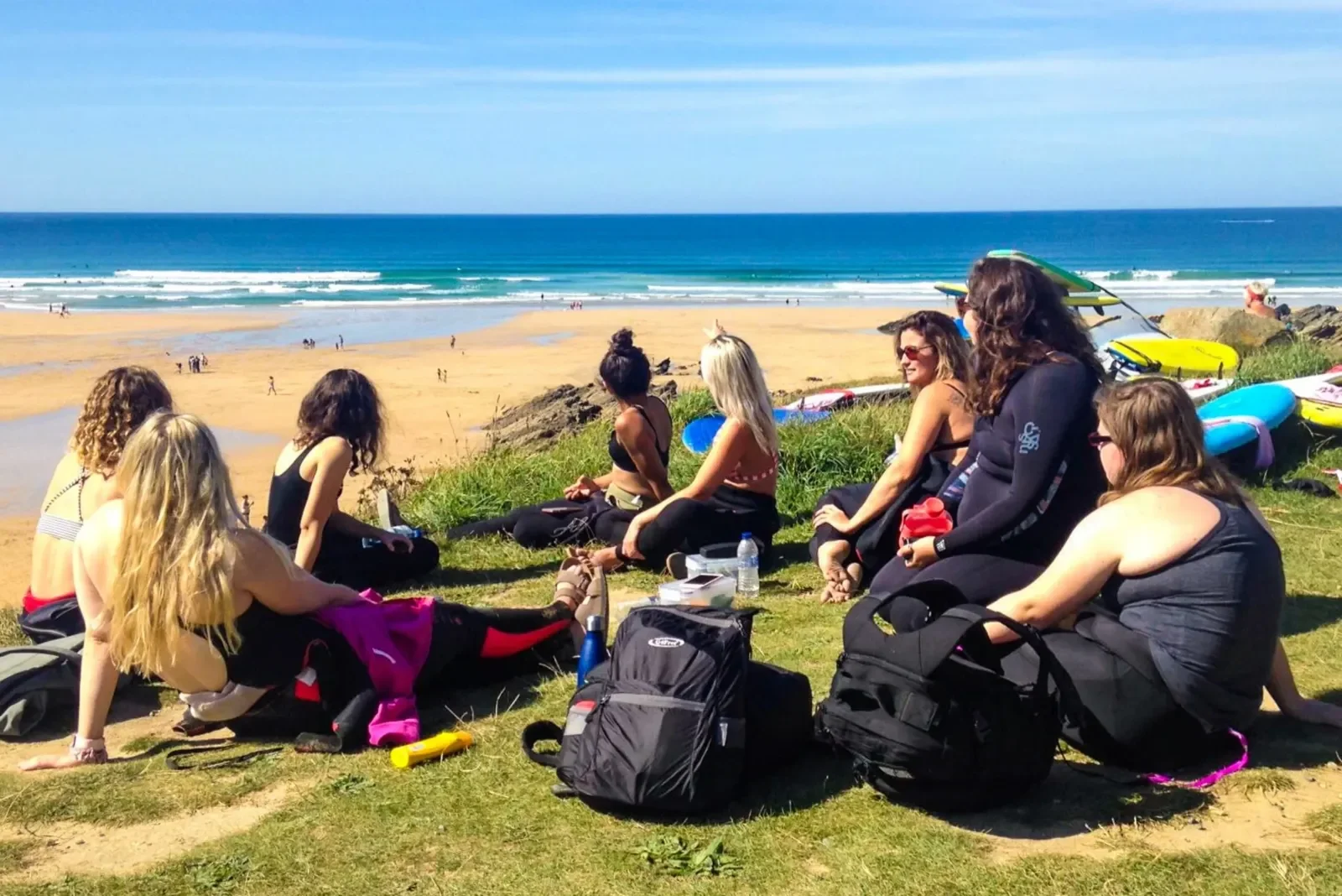 Ladies sat by the beach