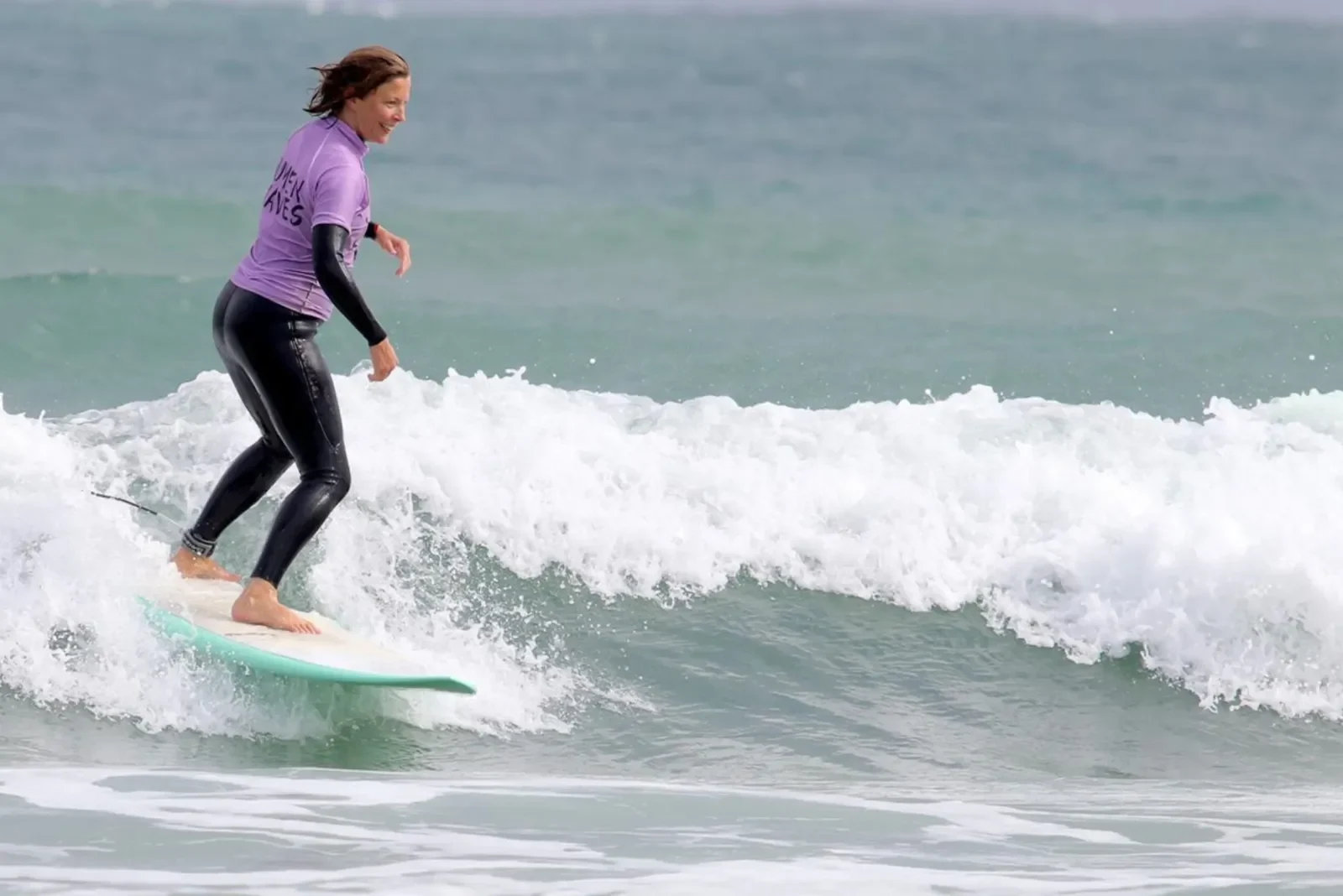 Female surfer on wave