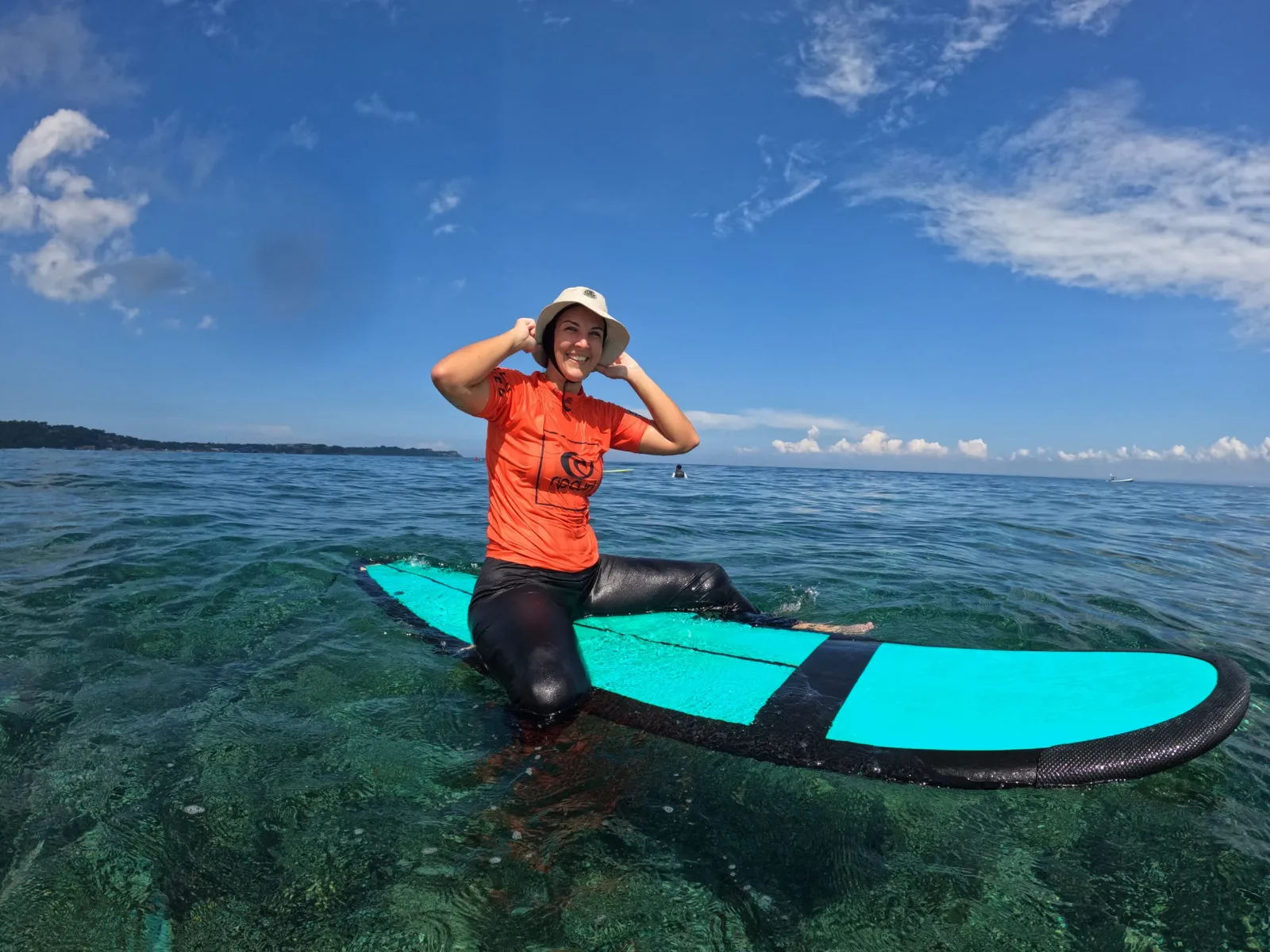 Nusa Lembongan Bali girl sat on surfboard