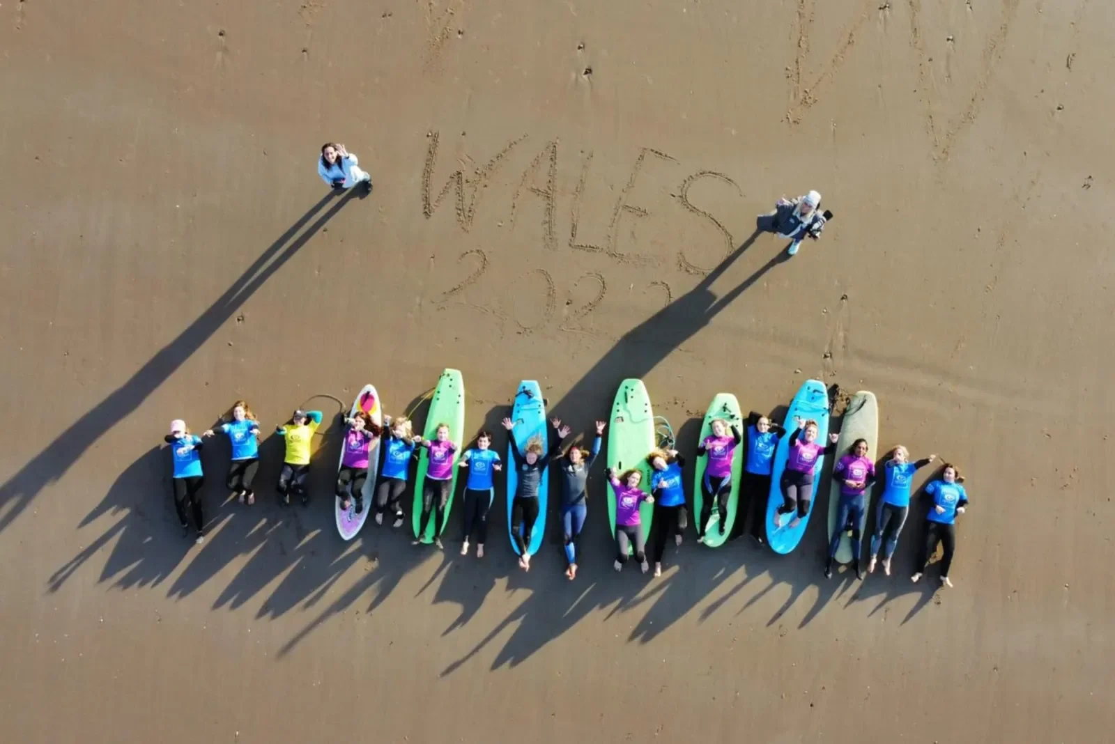 Women surfers on the beach