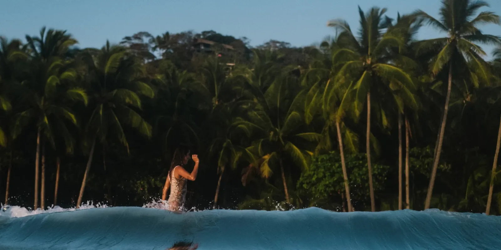 Girl surfer in jungle