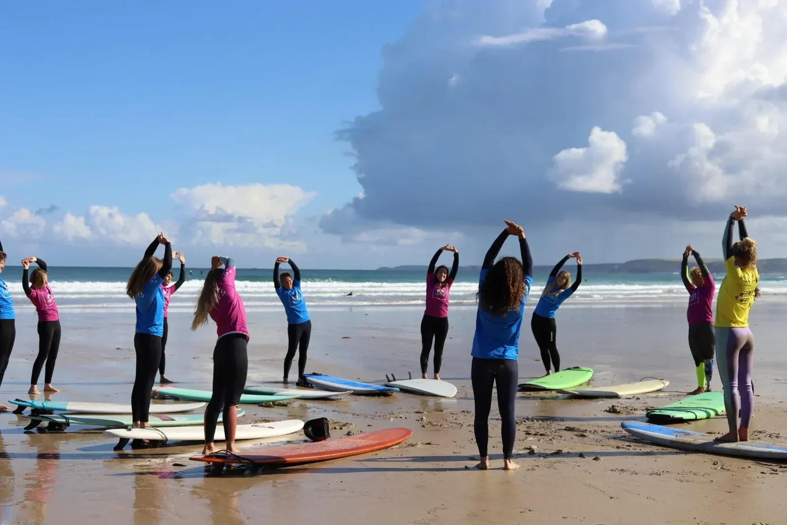 Women's Newquay Beginner Surf Weekends beach warm up