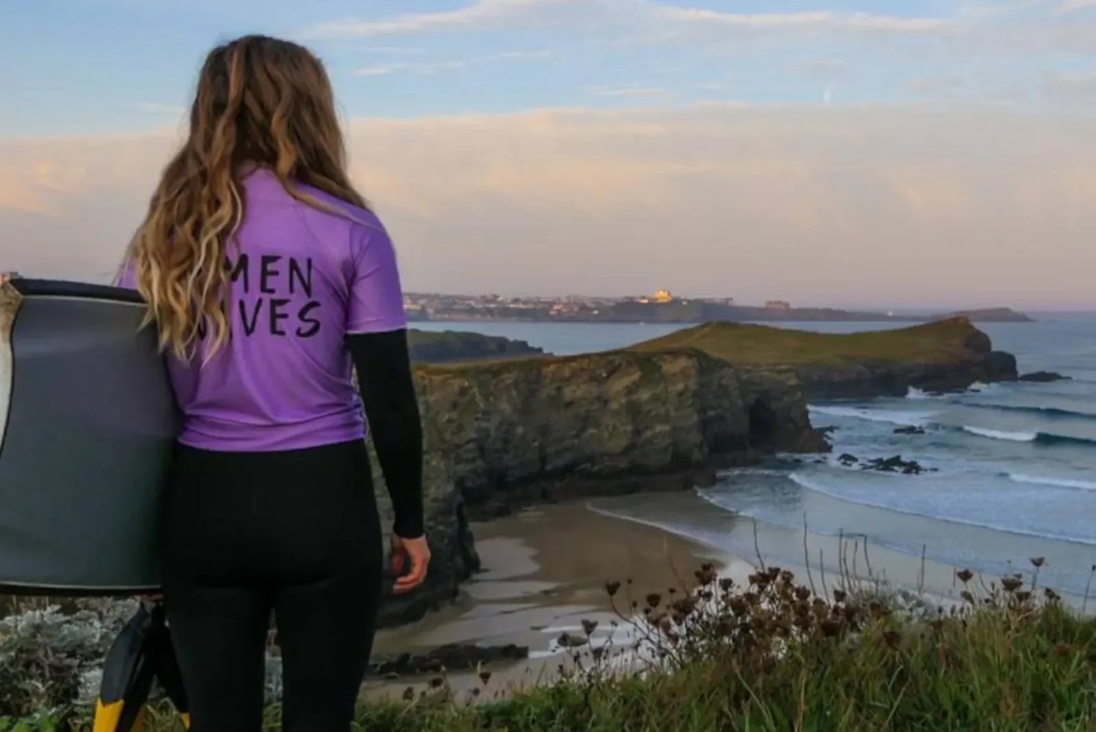 Female surfing checking the waves